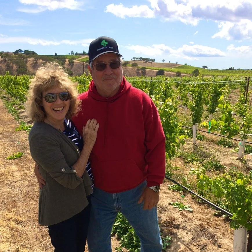 Serena & Michael in the vineyard.