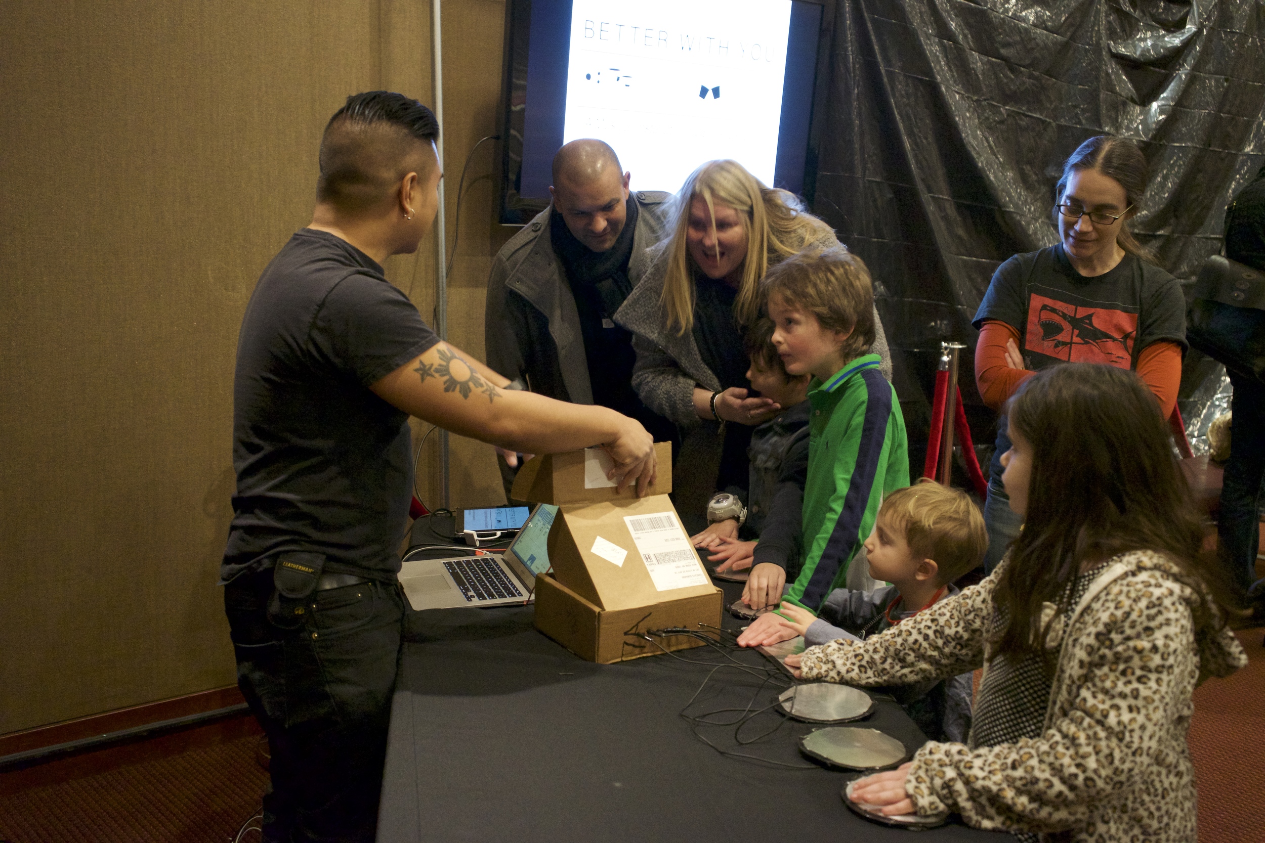 Here I am convincing some parents that the design of the installation is very simple and not run by the Great Old Ones.