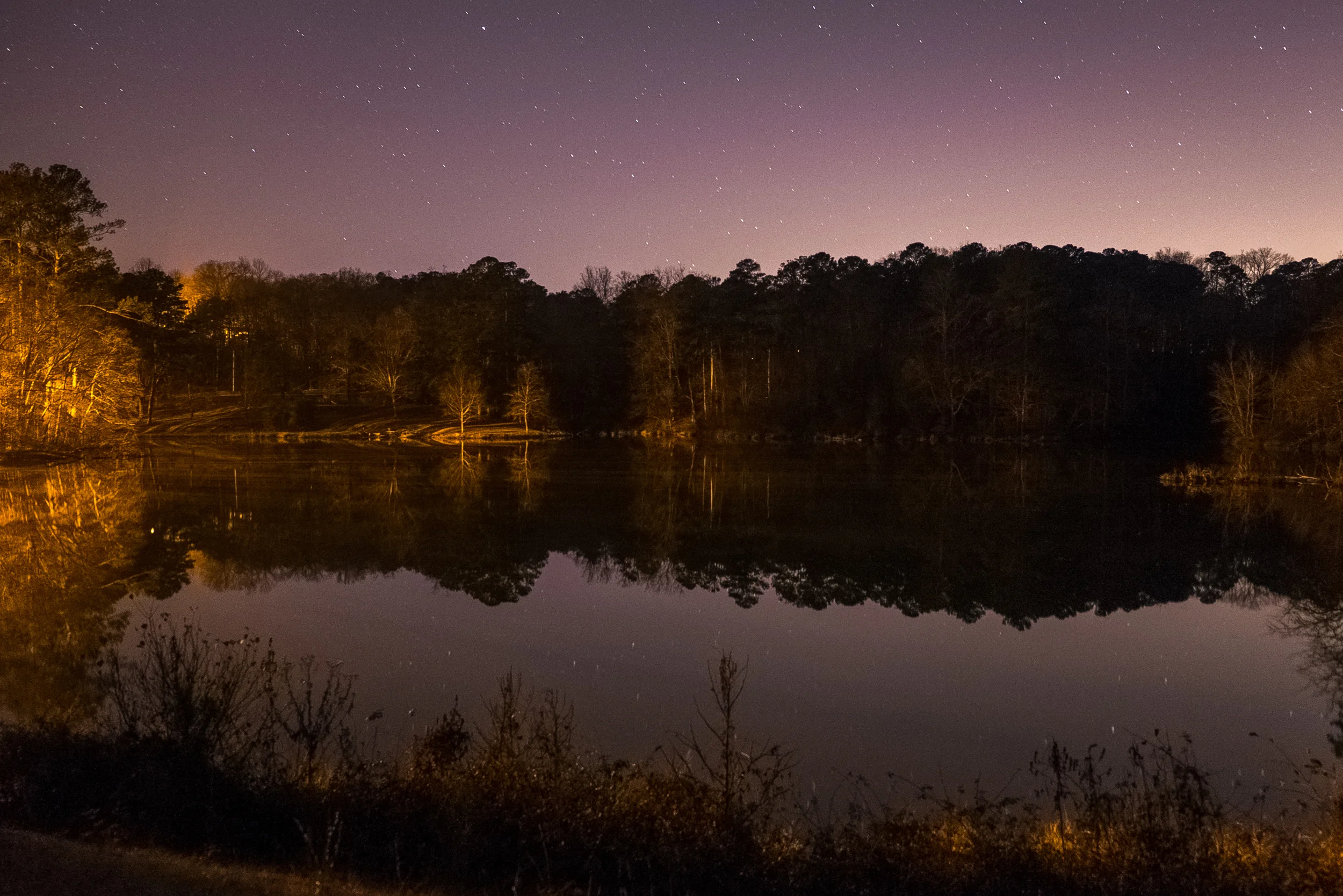 You can see the light pollution from a nearby city behind the trees. Unfortunately, this makes long exposures (very important for night photography) almost impossible. Caught a couple small meteors though. 