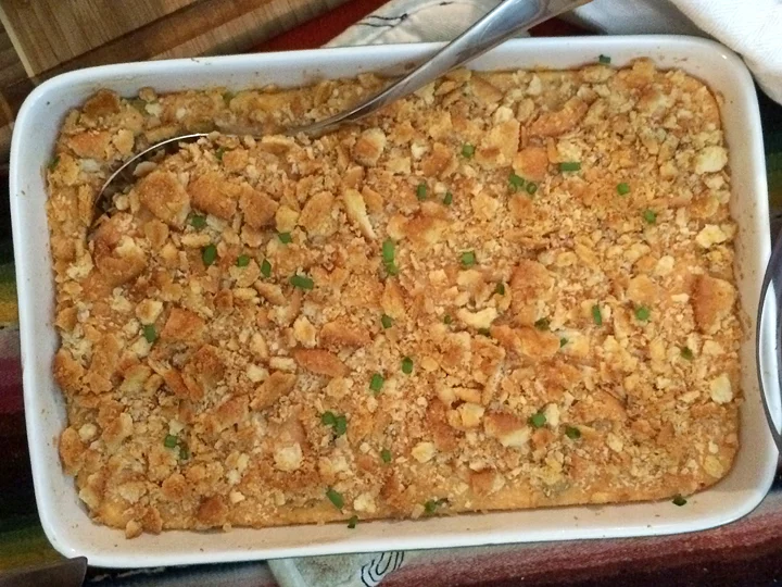 Kimcheeze Grits topped with Ritz crackers & scallions