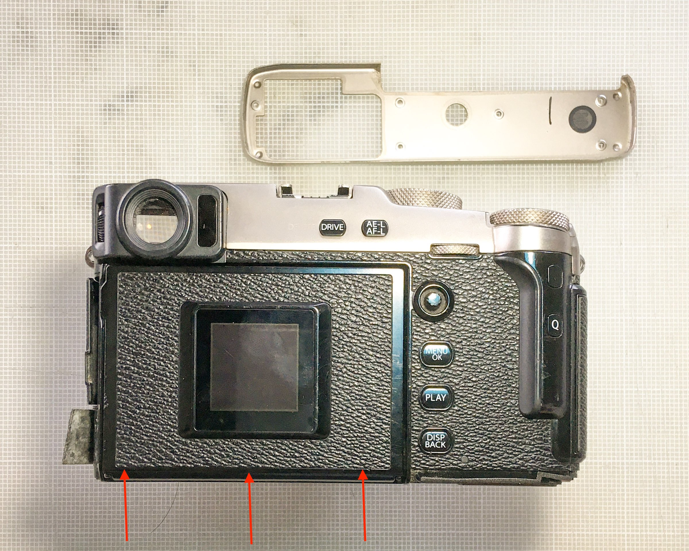  Pull up the bottom edge of the leatherette here, and there are three screws. 
