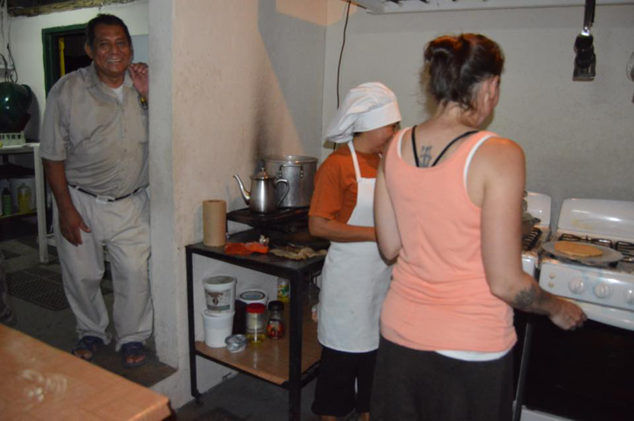 Metta, another guest at the camp, snapped this shot of Francelia teaching me and Dulcio laughing at my bumbling efforts!