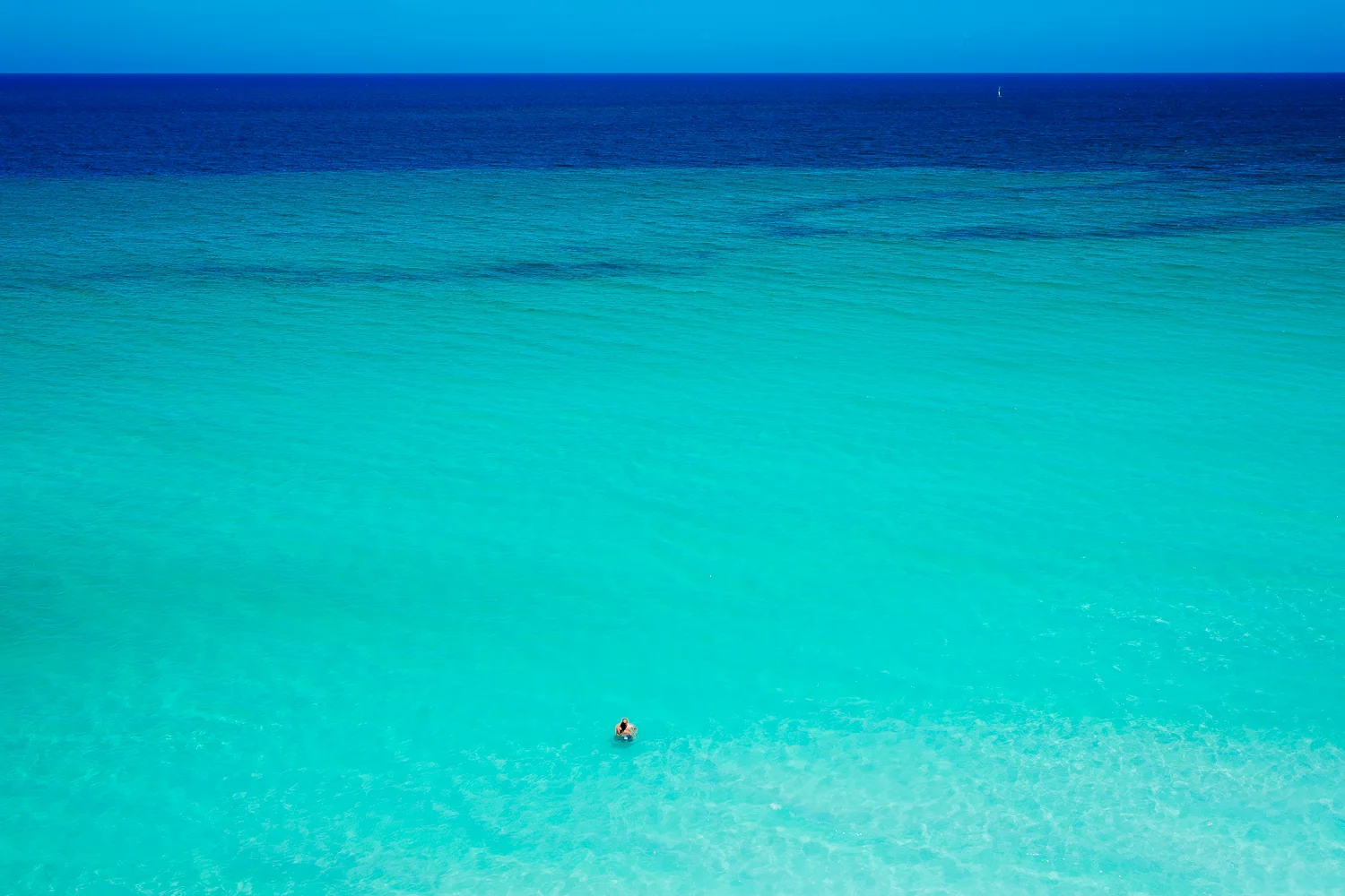 A couple all alone in the ocean in Varadero, Cuba 2015.