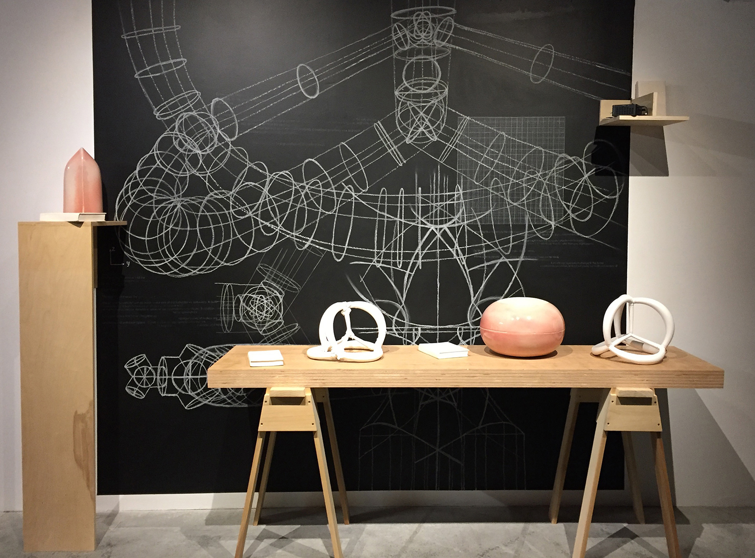 Timea Tihanyi, Perfect Imperfect. Bone china porcelain, various porcelain clay bodies, glaze, wooden table, chalkboard paint, projection, and chalk. 2016. Courtesy of Linda Hodges Gallery