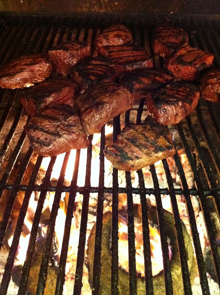 The soul of our kitchen is our grill, which burns local red oak.
