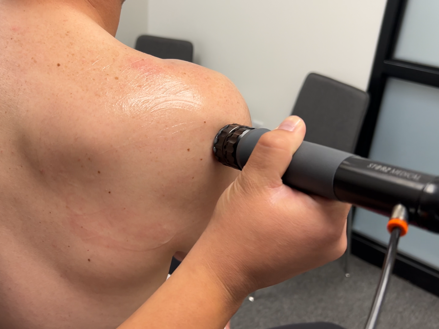 Dr. Reheisse at Revive Sport & Spine in Murray, Utah providing shockwave therapy for shoulder pain, rotator cuff tear, and calcific tendinitis.