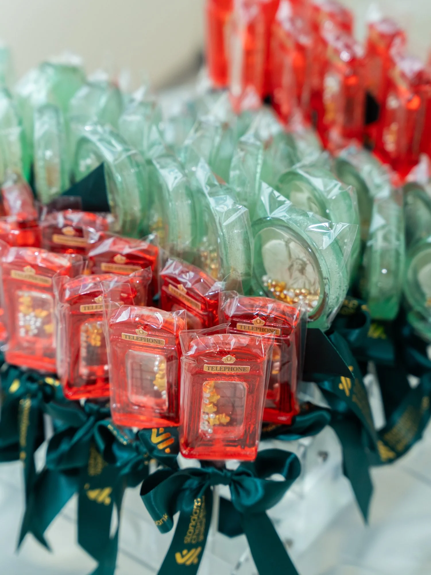 Close-up of small red gift bags with gold 