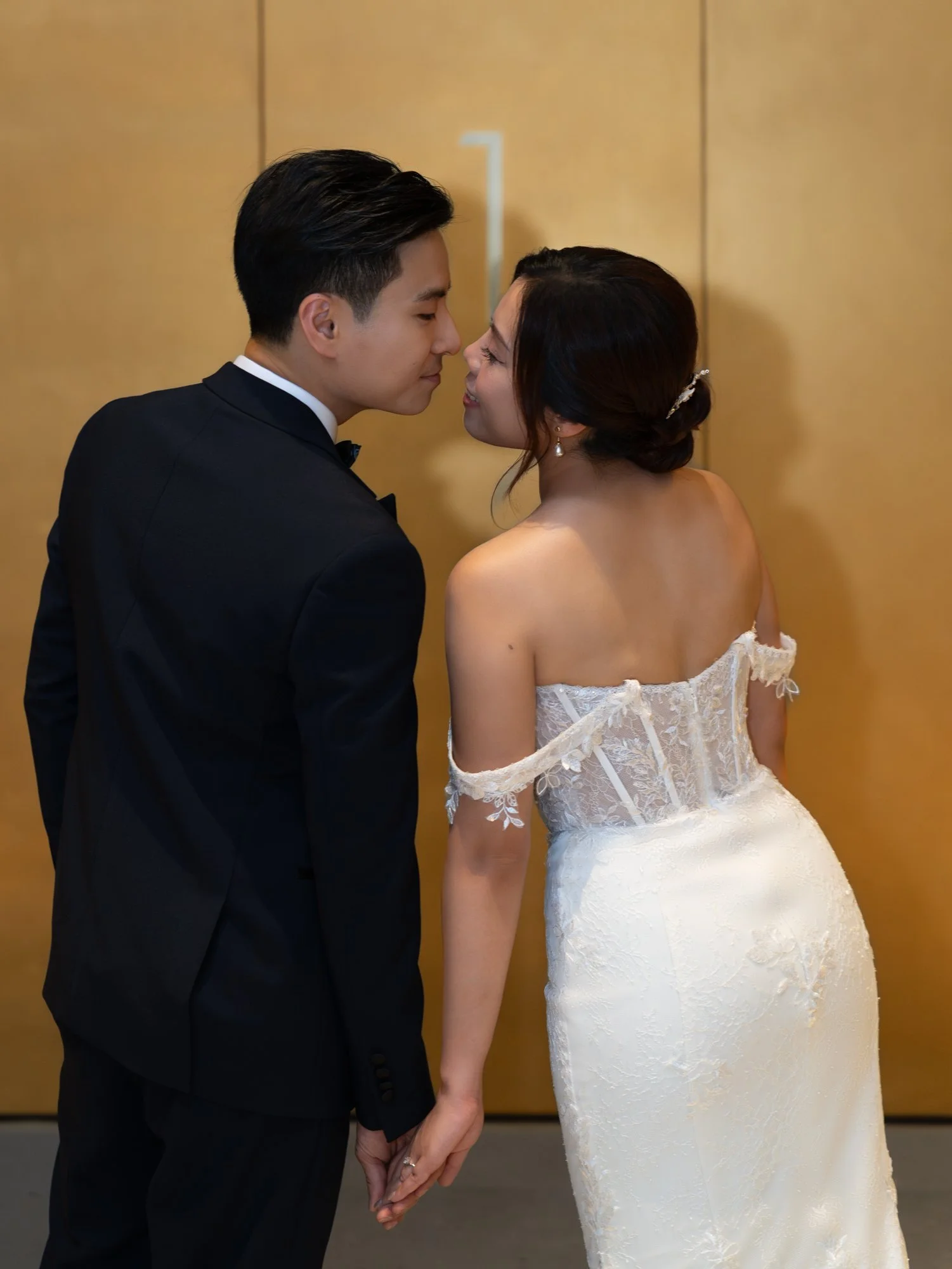 A couple tearing apart a wedding dress.