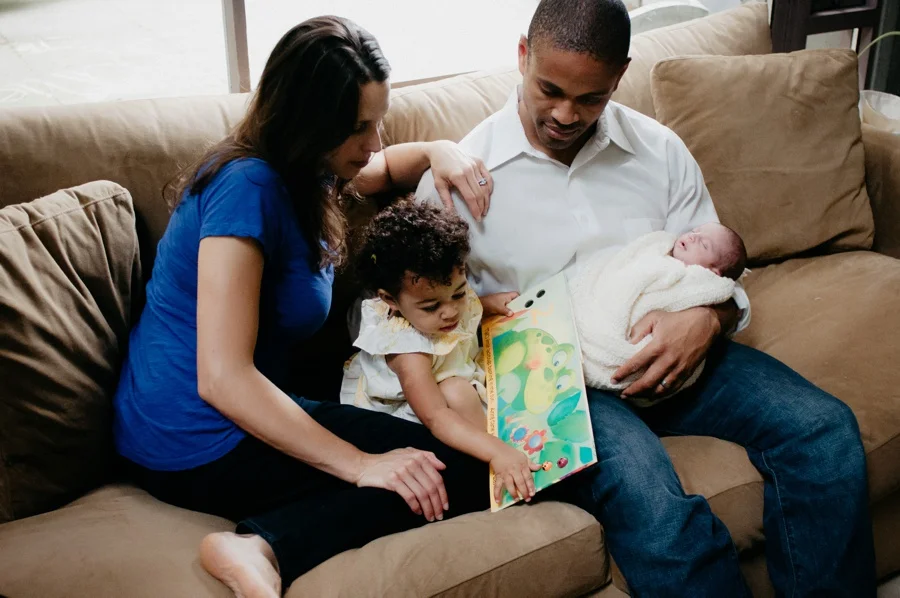 family with newborn baby