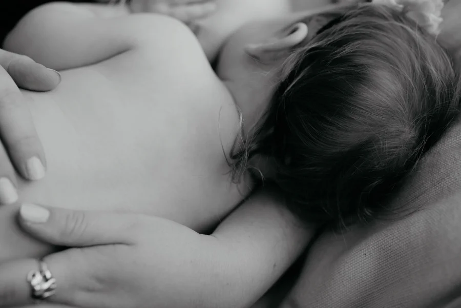 mother nursing toddler