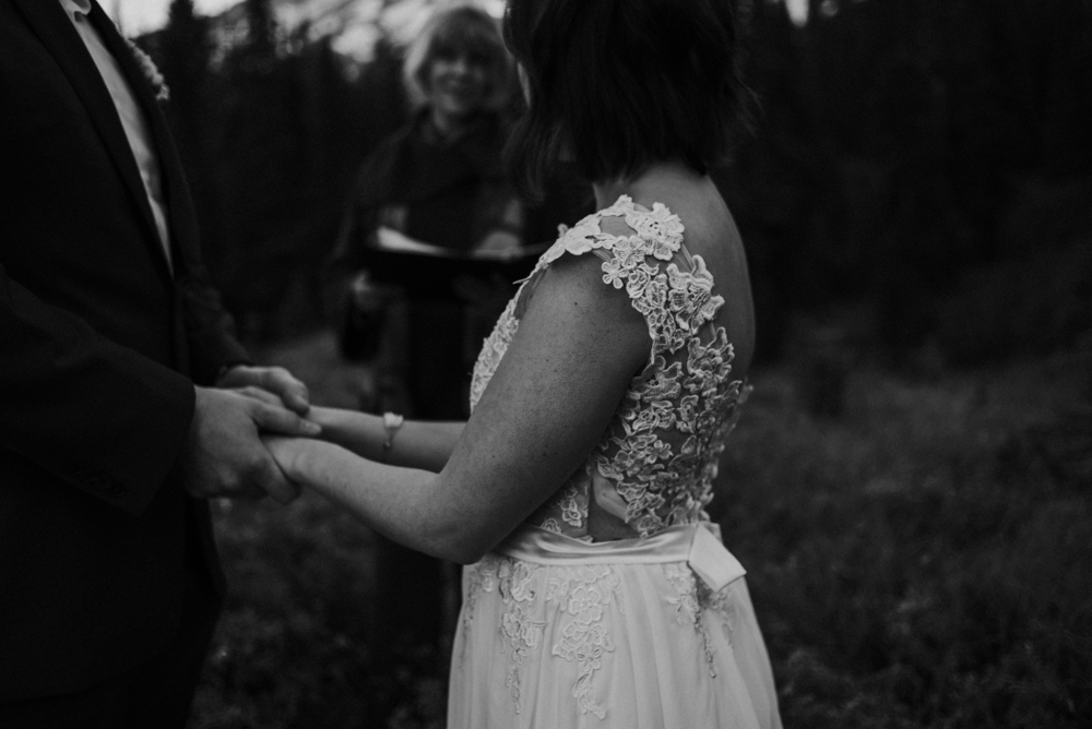 groom holding brides hand