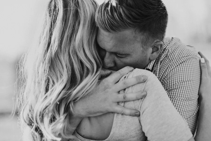 husband embracing wife