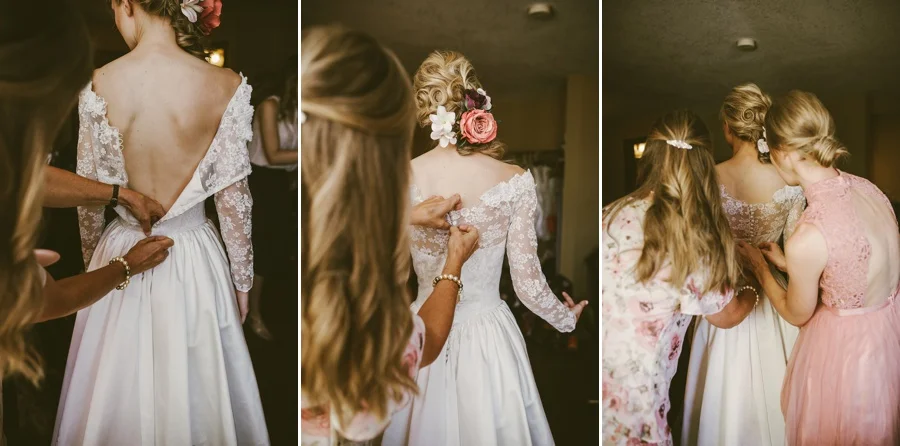 Bride getting dress put on