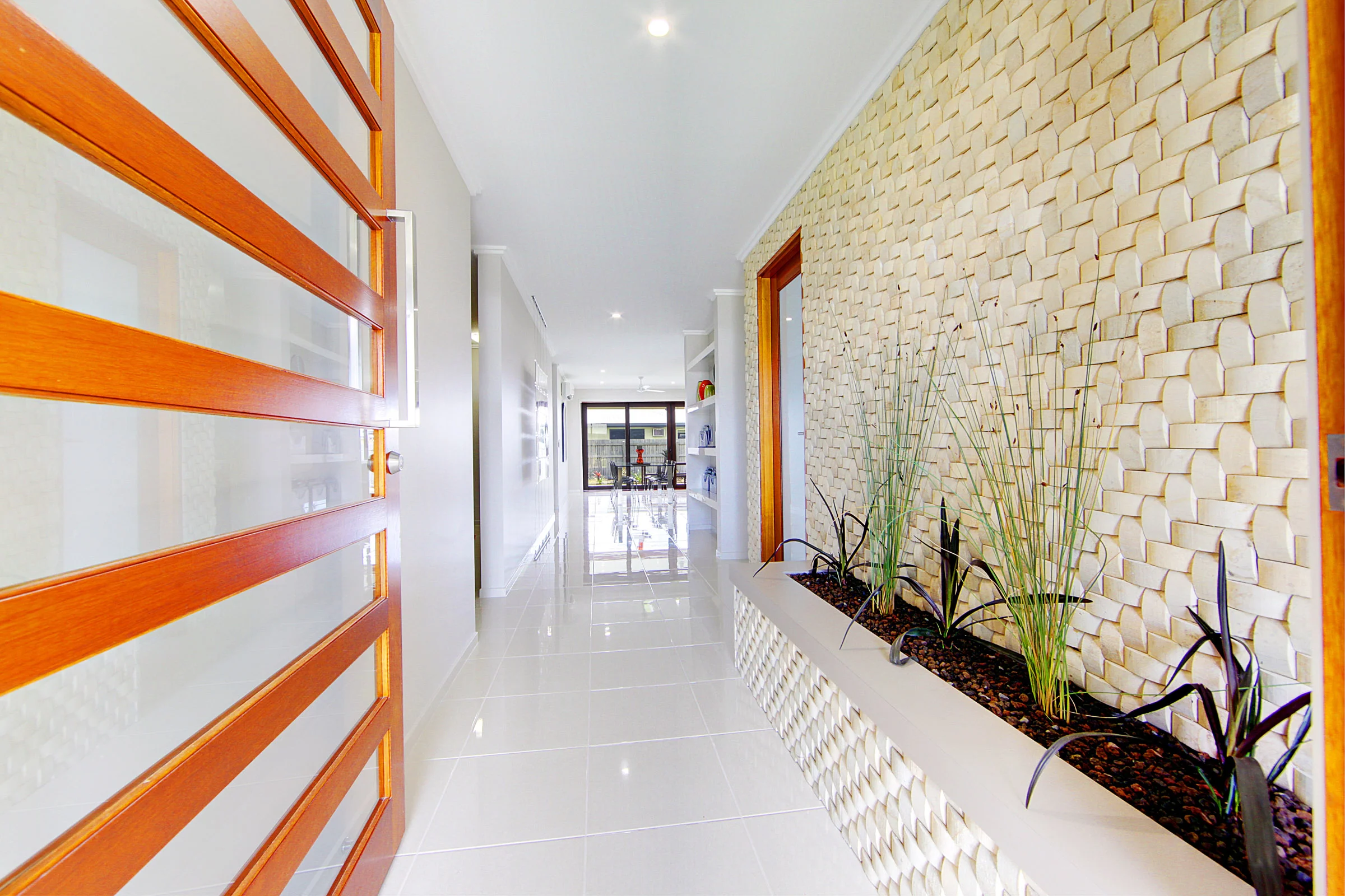 Entry Foyer With Large Timber Pivot Door & Indoor Garden.Display Home, Townsville QLD