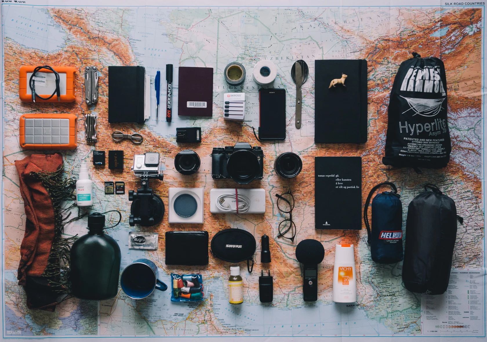 Some of the things I'll be bringing with me. Not pictured: sleeping bag, bags, a few lenses and a kindle I still have to buy, clothes (there aren't many but I'm prepared for four seasons), toiletries, etc..