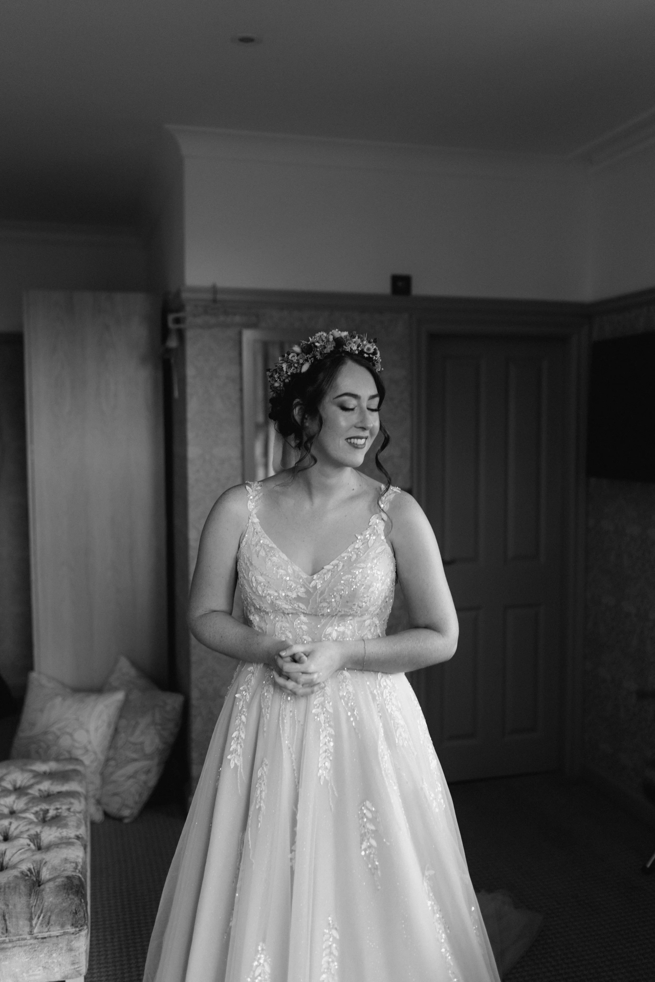  The bride is wearing her dress and is ready to get married in the Lake District.  