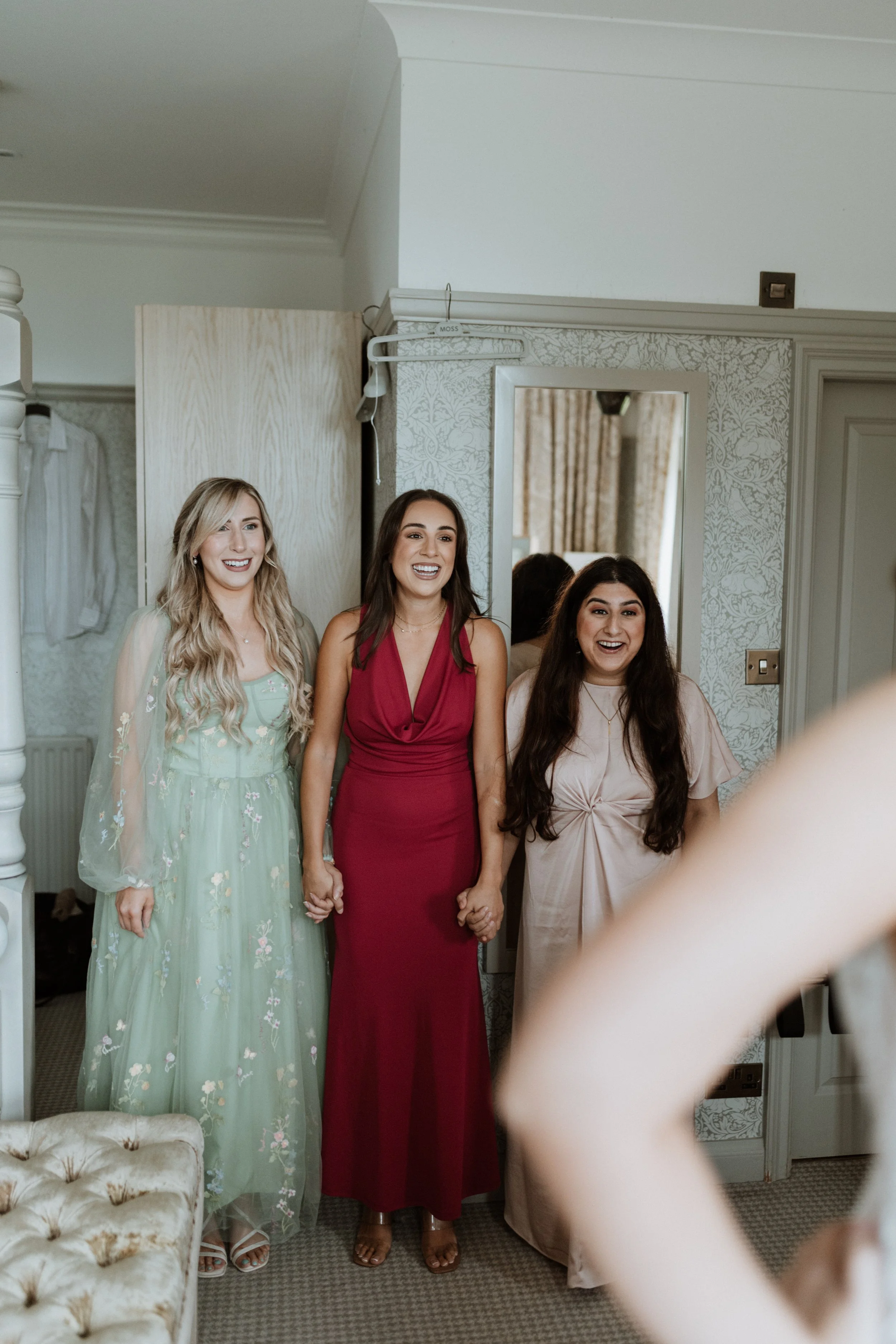  The reactions of the brides friends during a first look are surprised and happy.  