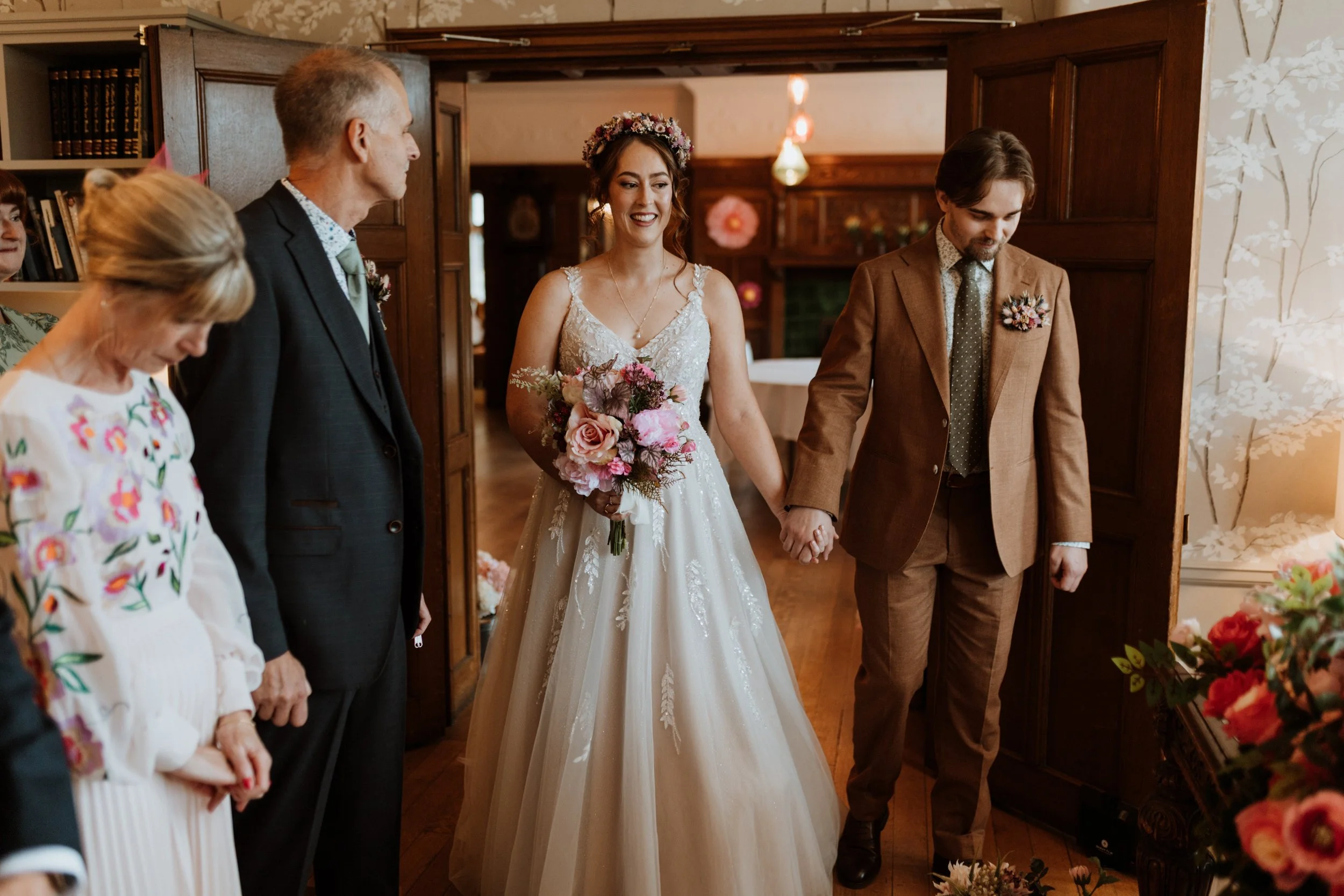  The bride and groom enter their ceremony together in the Lake District. 