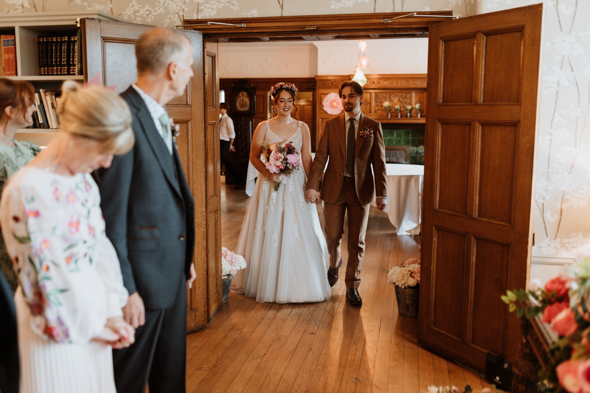  The bride and groom enter their ceremony room together at Cragwood Hotel.  