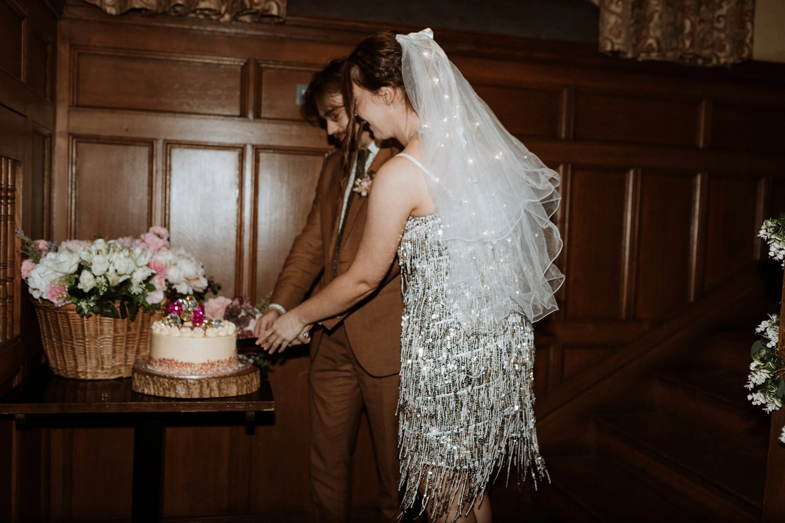  The bride and groom cut their wedding cake at Cragwood Hotel.  