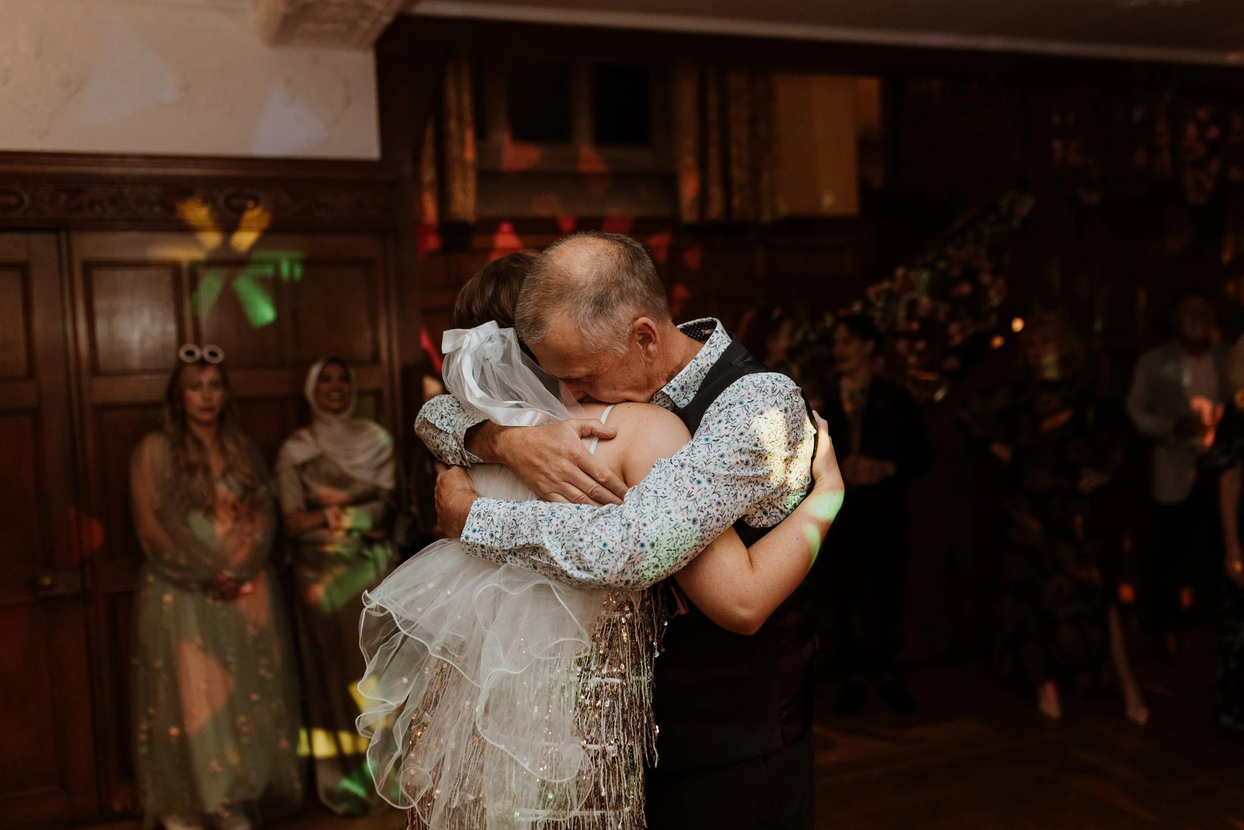  The bride and her father hug on the dance floor at Cragwood Hotel in the Lake District.  