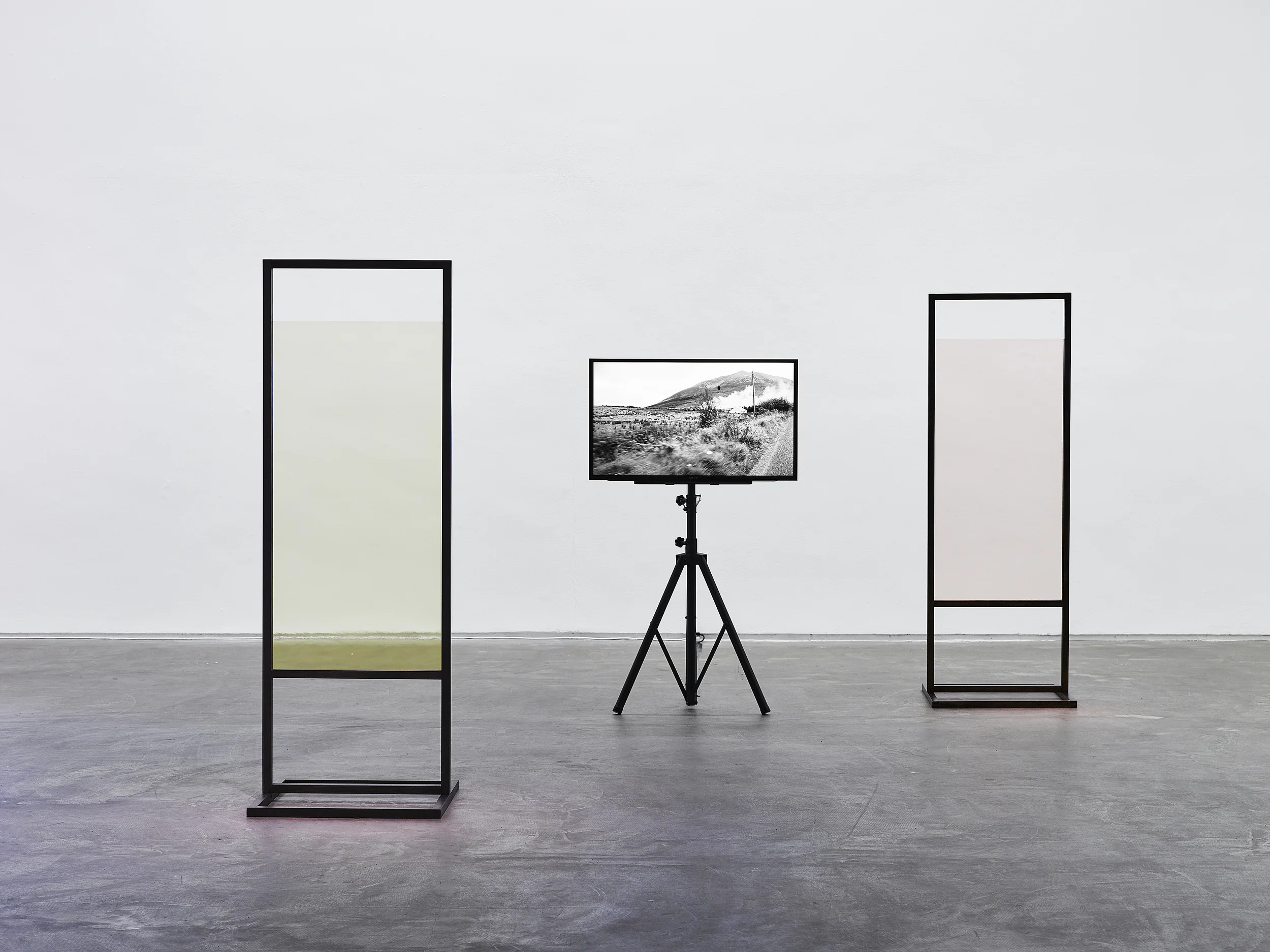 Douglas Hyde Gallery, 2015 Stand (Pale straw) 2014, Pencil on beech stand, coloured glass 1890 x 655 x 650 Nephin, 2014, Single channel HD video, 29 min loop, silent, 16:9 Stand (Rose), 2014, Beech frame & stand, coloured glass, 1890 x 655 x 650 mm Photo Ros Kavanagh