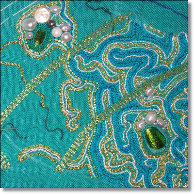 In this photograph, the gold threads are worked in either couching, or chain stitch