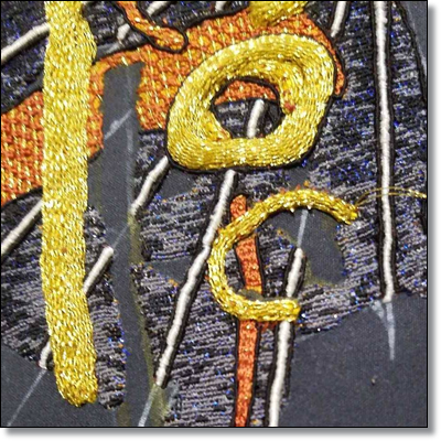 In this photograph, the gold is worked in raised stem stitch.