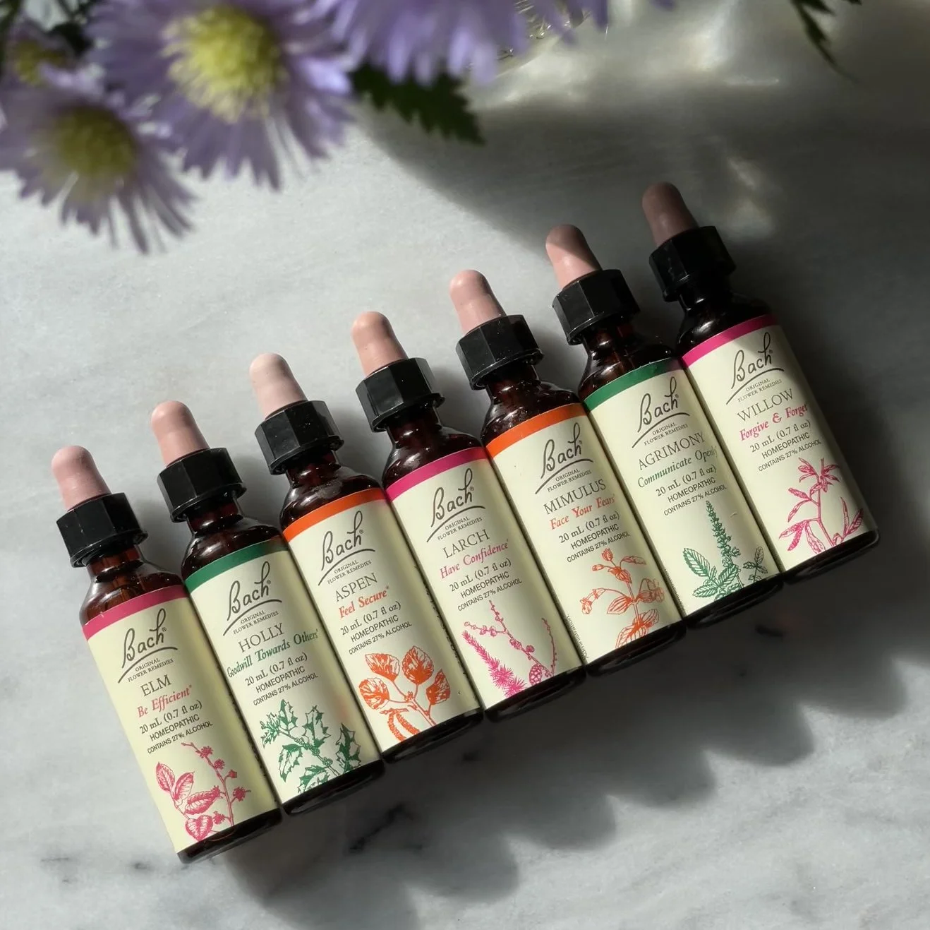 Photograph of each of the 7 color groups for Bach Original Flower Remedies’ 20mL size product. The traditional-formula range consists of 38 products and has no carton container. Actual size: 2.89” x 2.05” full label.