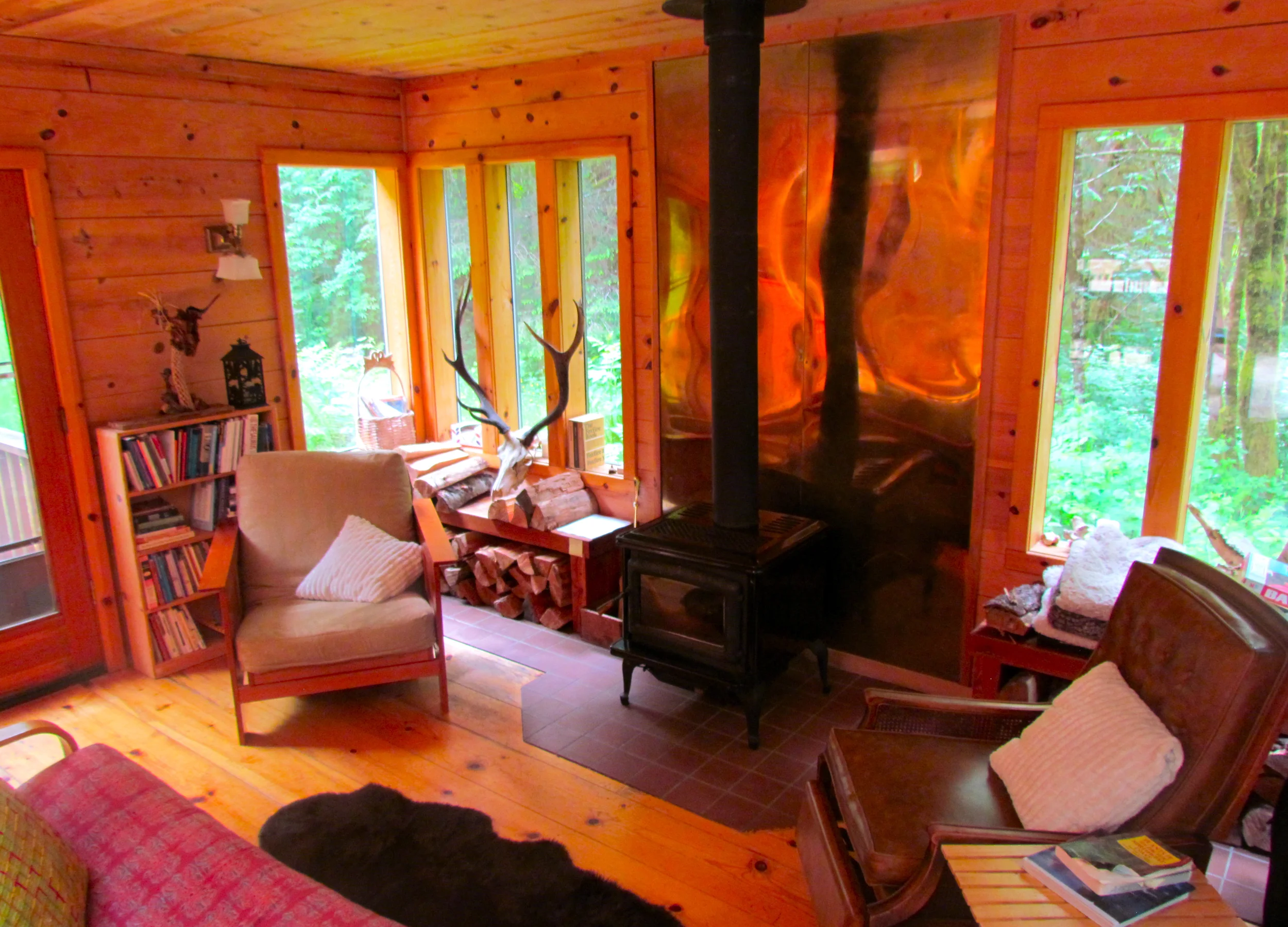 Here is the cozy living room with a woodstove