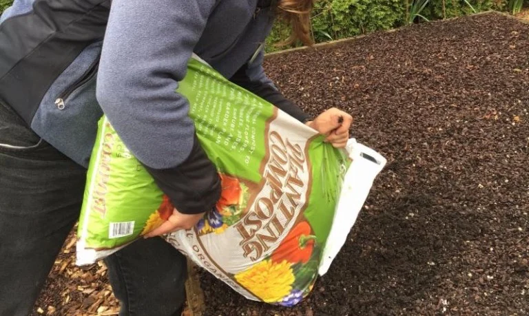 Daniel with compost bag.jpg