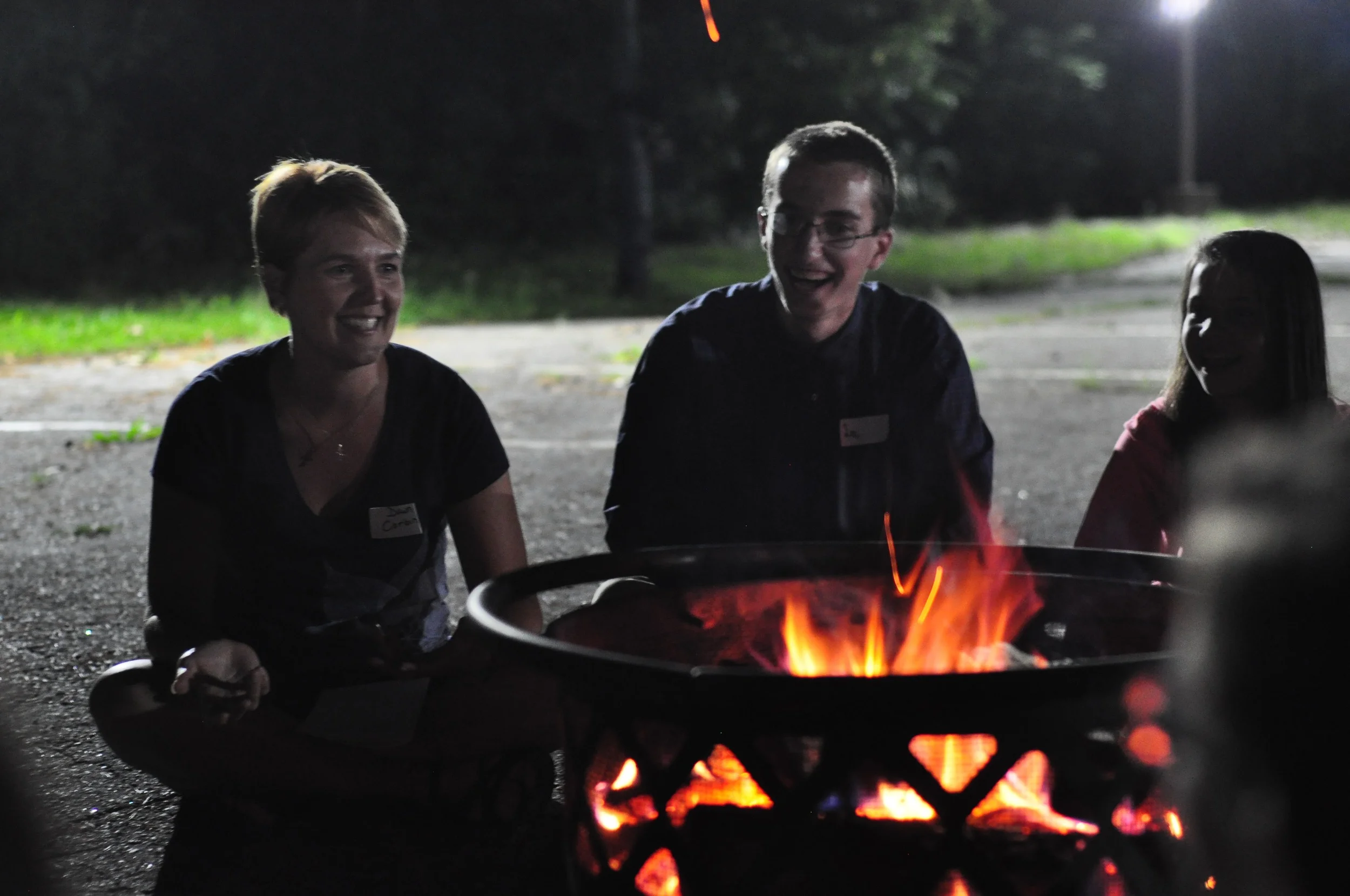 Mrs. Corbin with students at the fire pits that close out the evening.