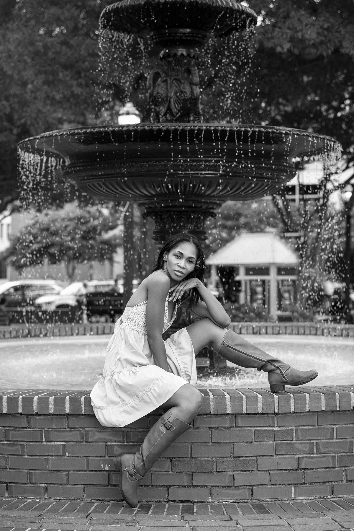 Kia standing in a relaxed pose outdoors in Downtown Marietta, GA, for a lifestyle photoshoot, surrounded by urban scenery with natural light.