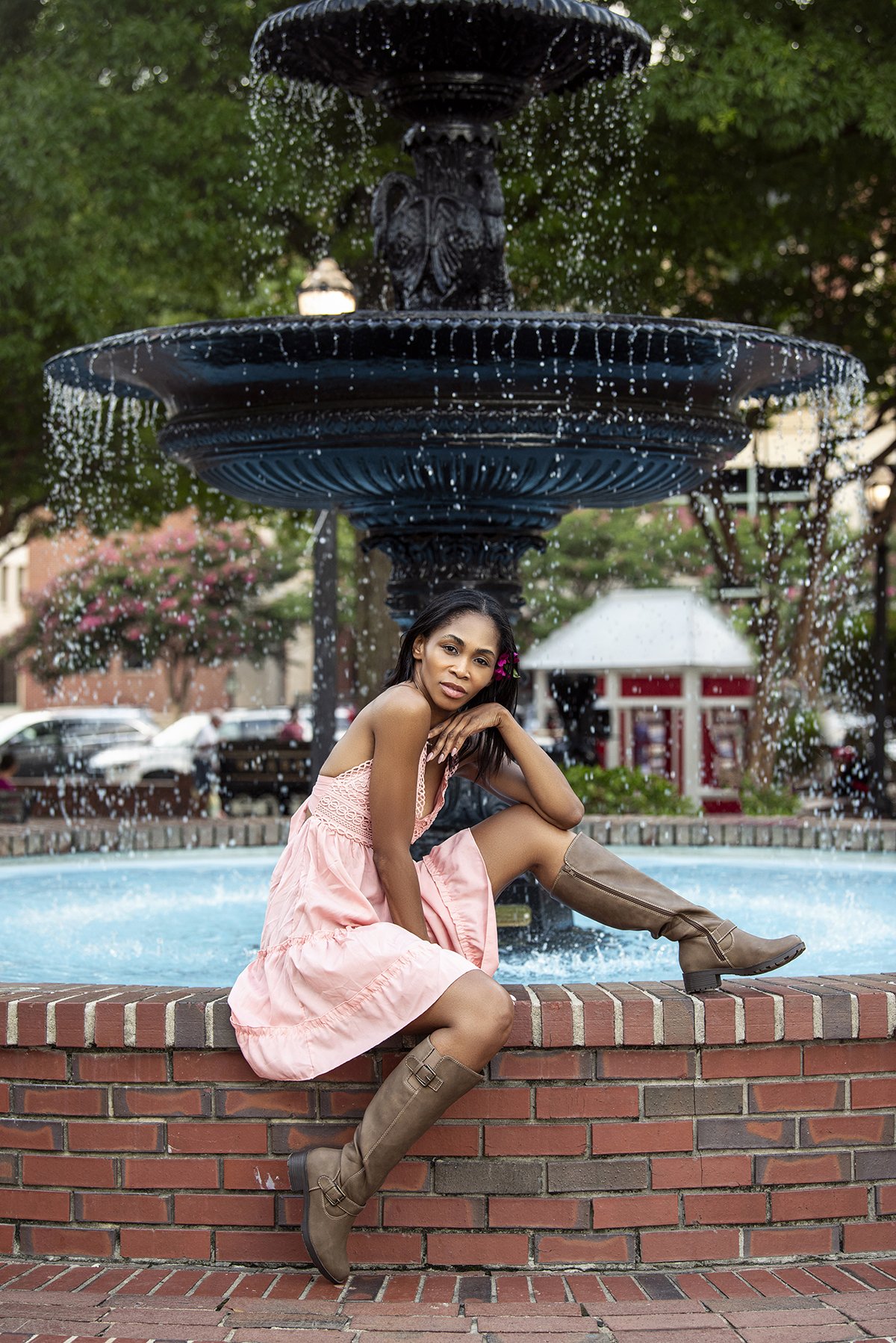 Kia standing in a relaxed pose outdoors in Downtown Marietta, GA, for a lifestyle photoshoot, surrounded by urban scenery with natural light.