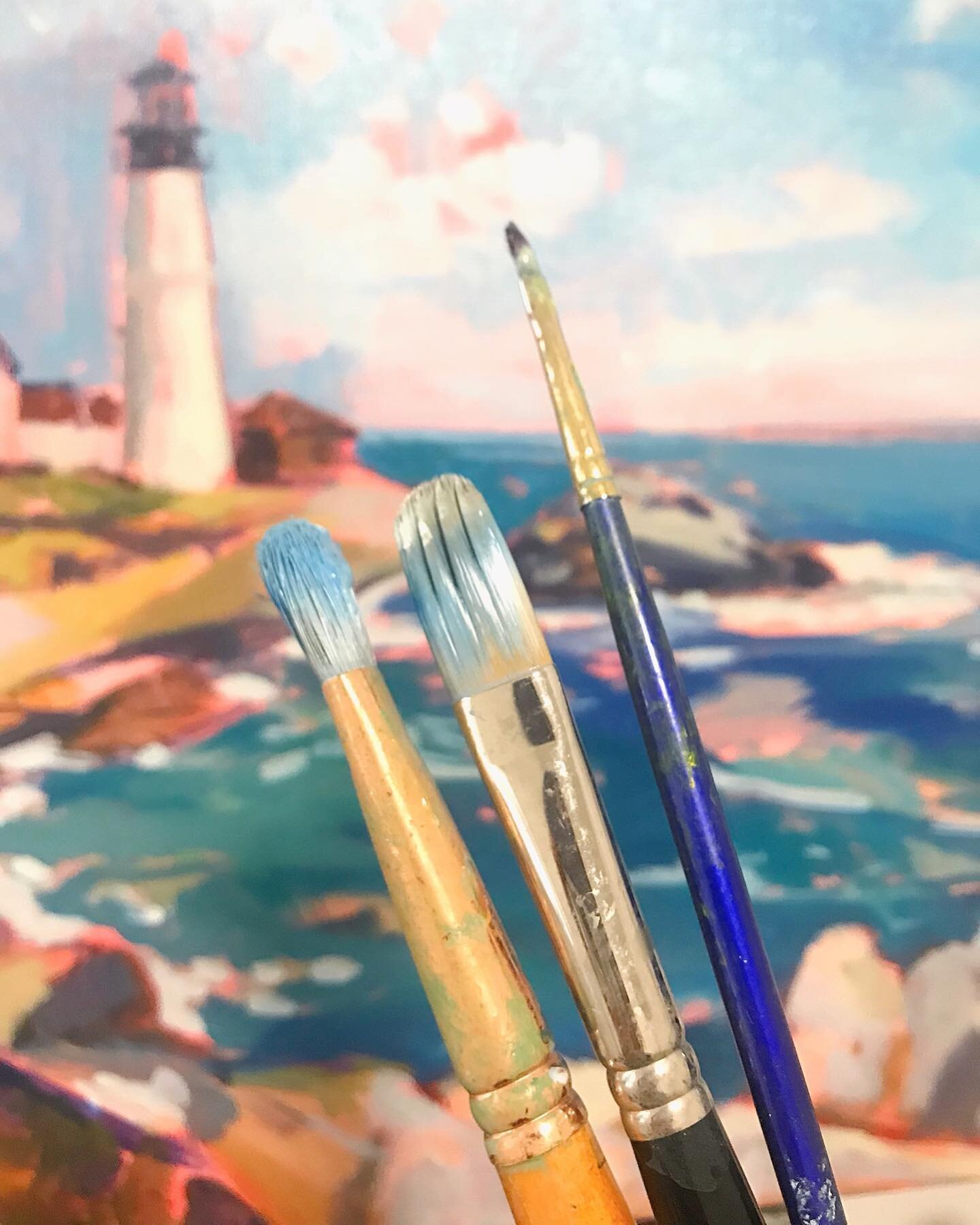 Making progress on these last 2 Maine paintings! This here is a typical view as I work, holding multiple brushes at a time. 🎨