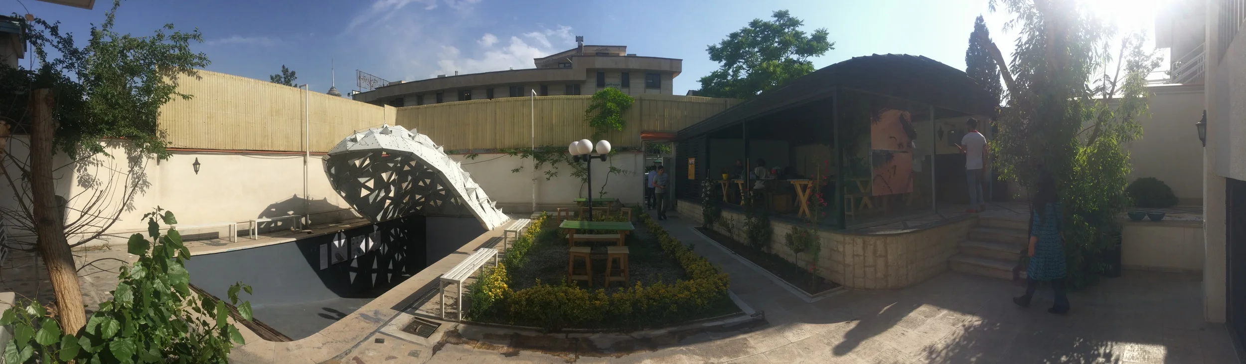 The courtyard of the school villa set up by Alireza Taghaboni with the swimming pool auditorium on the left.