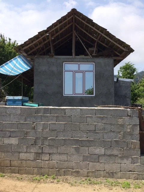 Old meets new: the traditional large wooden structures on top of concrete blocks with aluminum frames.
