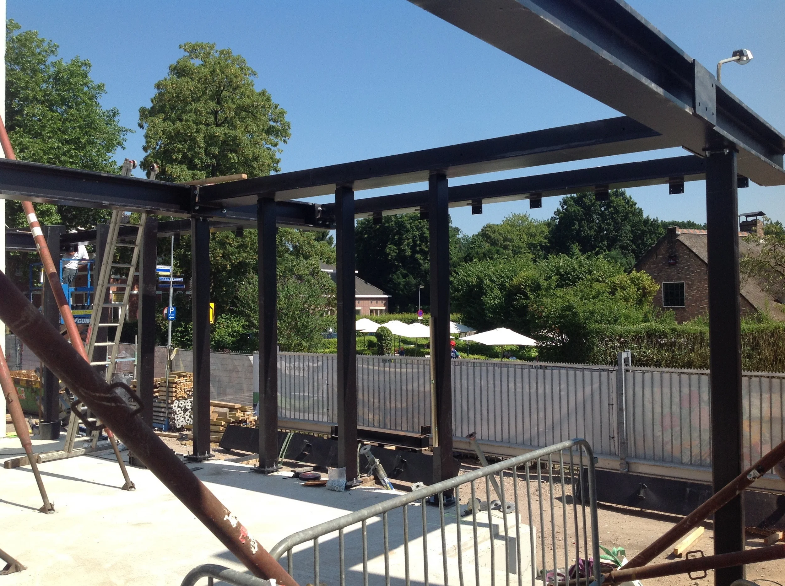 The street facade with the canopy slowly appearing.