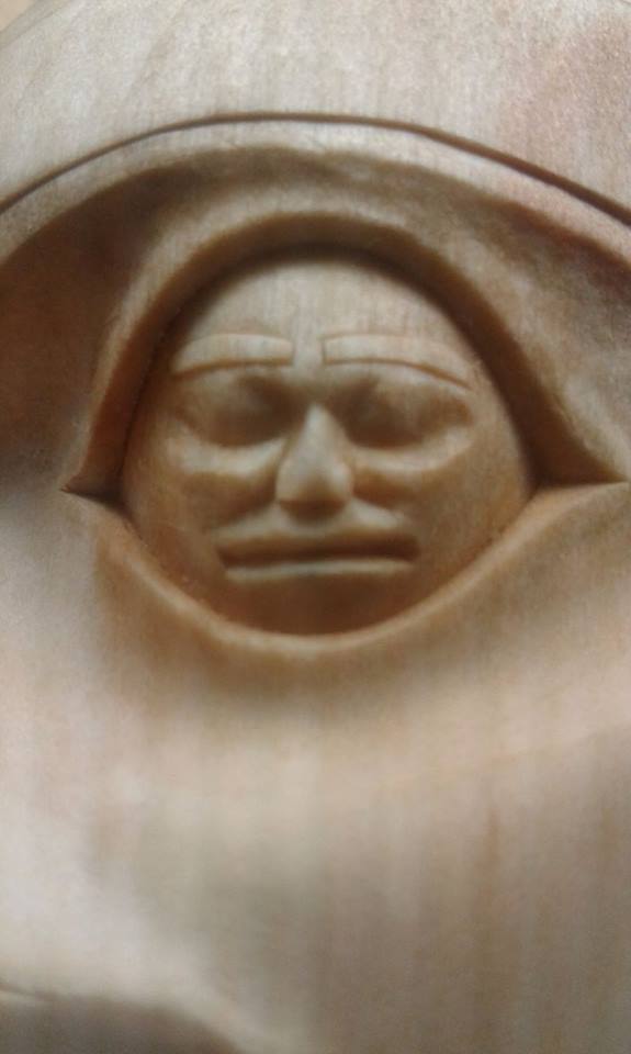 A close-up of detailed carving within the eyes. 