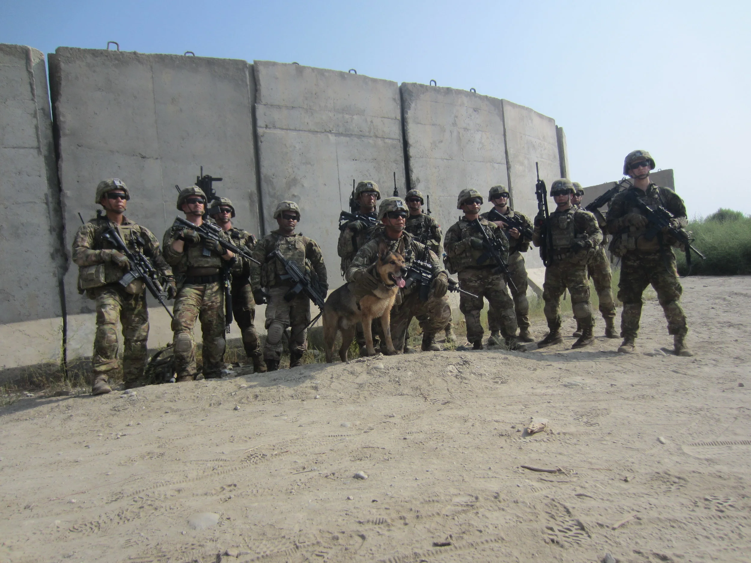 1LT Brehany's platoon poses for a picture with after a mission in Afghanistan (1LT Brehany on far right).