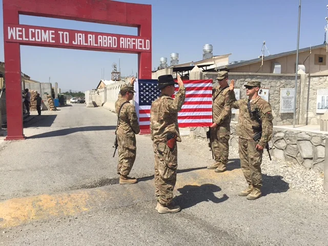 1LT Brehany re-enlists a soldier at Jalalabad Airfield in Afghanistan.