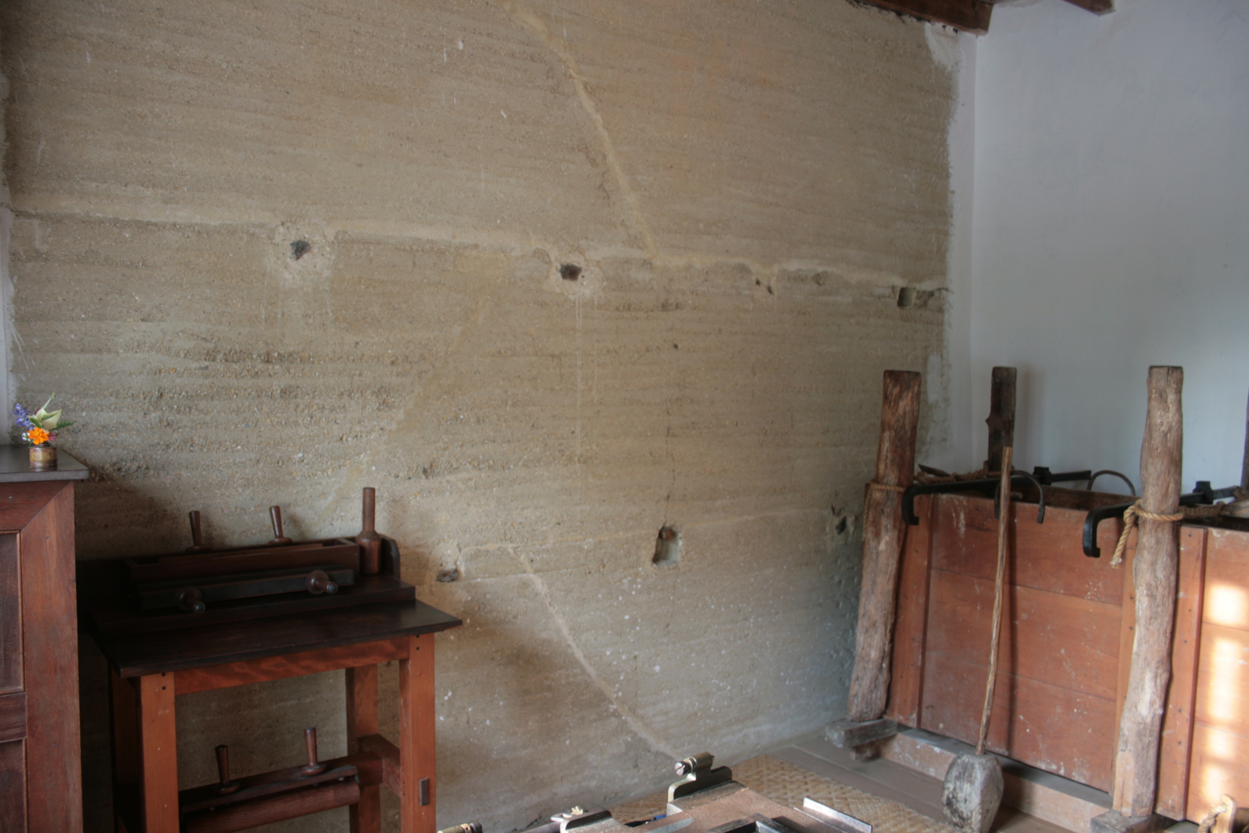 Restored rammed earth wall internal face