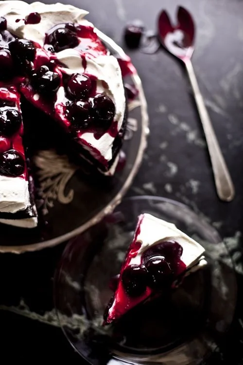 Kimber - lush, tart, gracious Double Chocolate Layer Cake with Spicy Chocolate Ganache, Spiked Whipped Cream and Liqueur Soaked Cherries ( source )