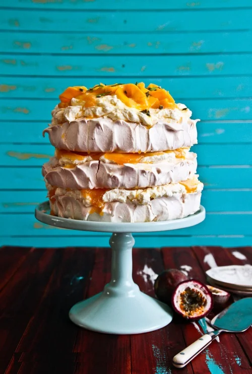 Charity - bright, cheery, fabulous Layered Pavlova Filled with French Vanilla Butter Cream and Passion Fruit Puree ( source )