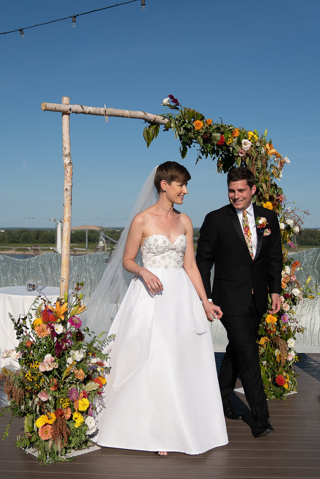 Wedding Ceremony with wildflower arch