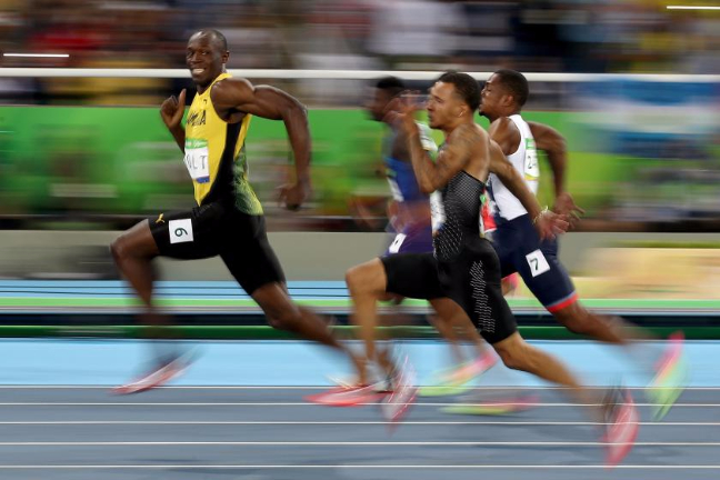 Usain Bolt of Jamaica - Winning Gold 100m [Source: Cameron Spencer/Getty Images ]