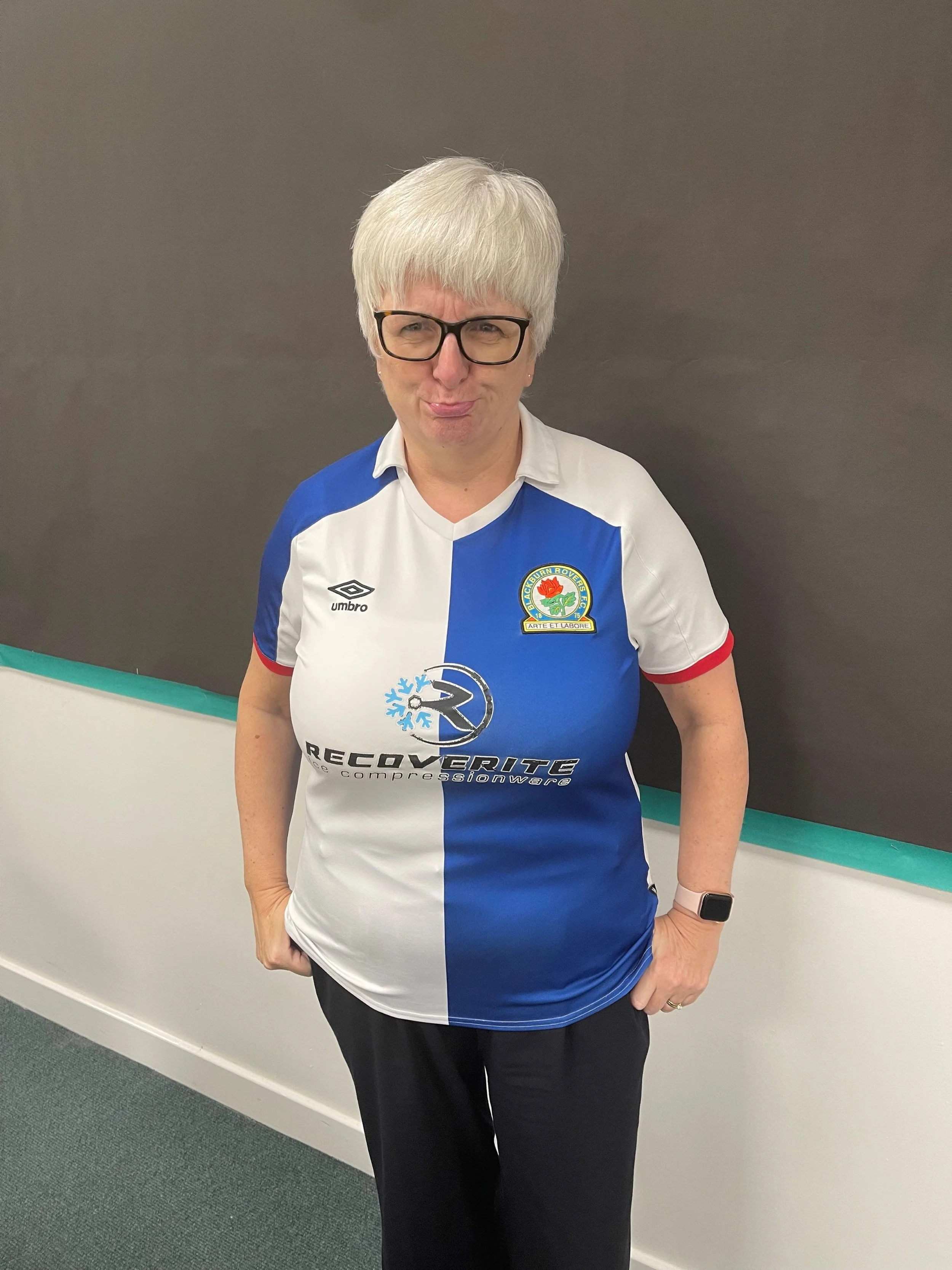 Michelle Strong wearing a Blackburn Rovers shirt