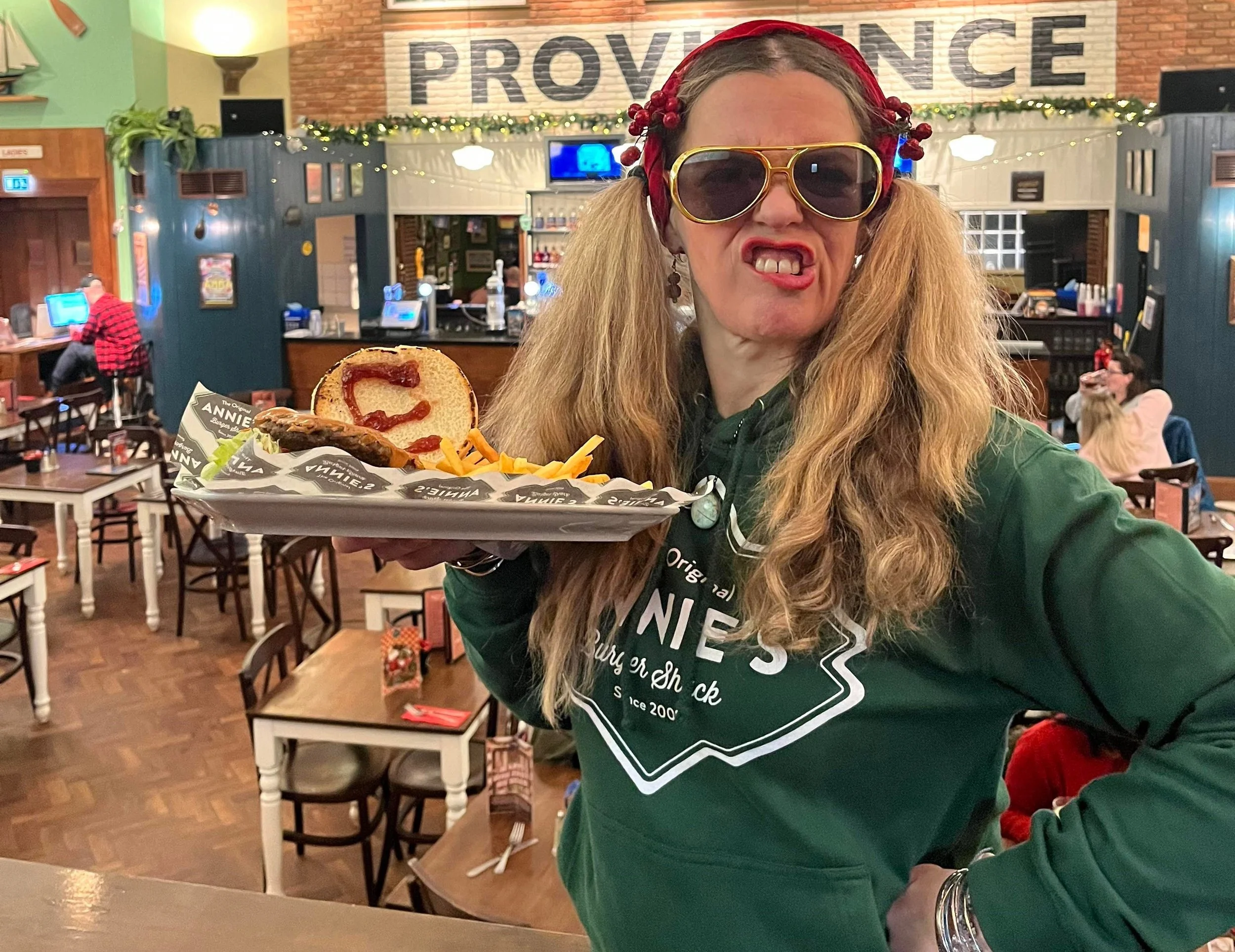 Annie Spaziano, owner of Annie’s Burger Shack, with the restaurant’s iconic The Elvis burger, which has been restored to the menu after a year and a half away.
