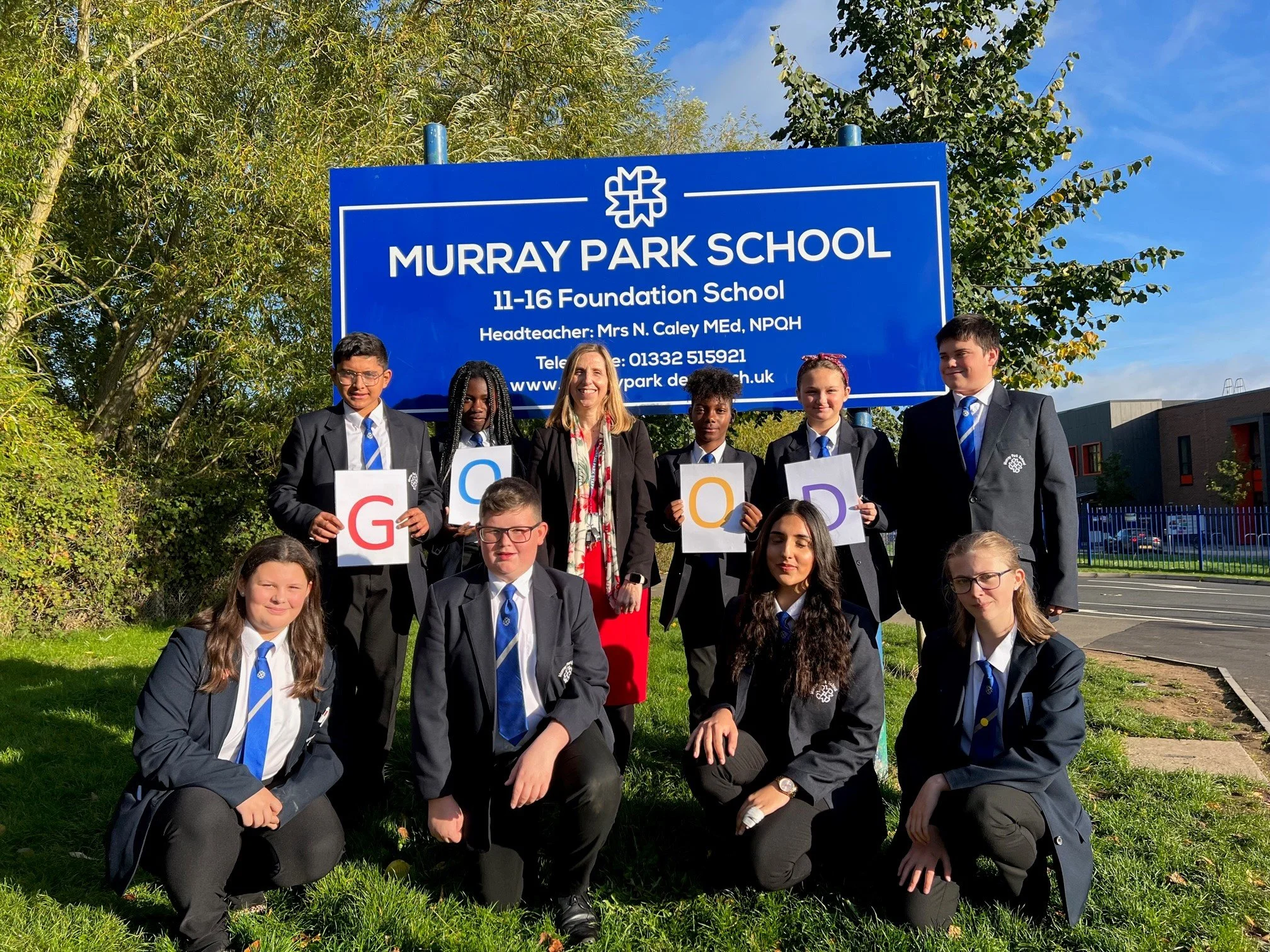 Headteacher Nicola Caley and pupils.