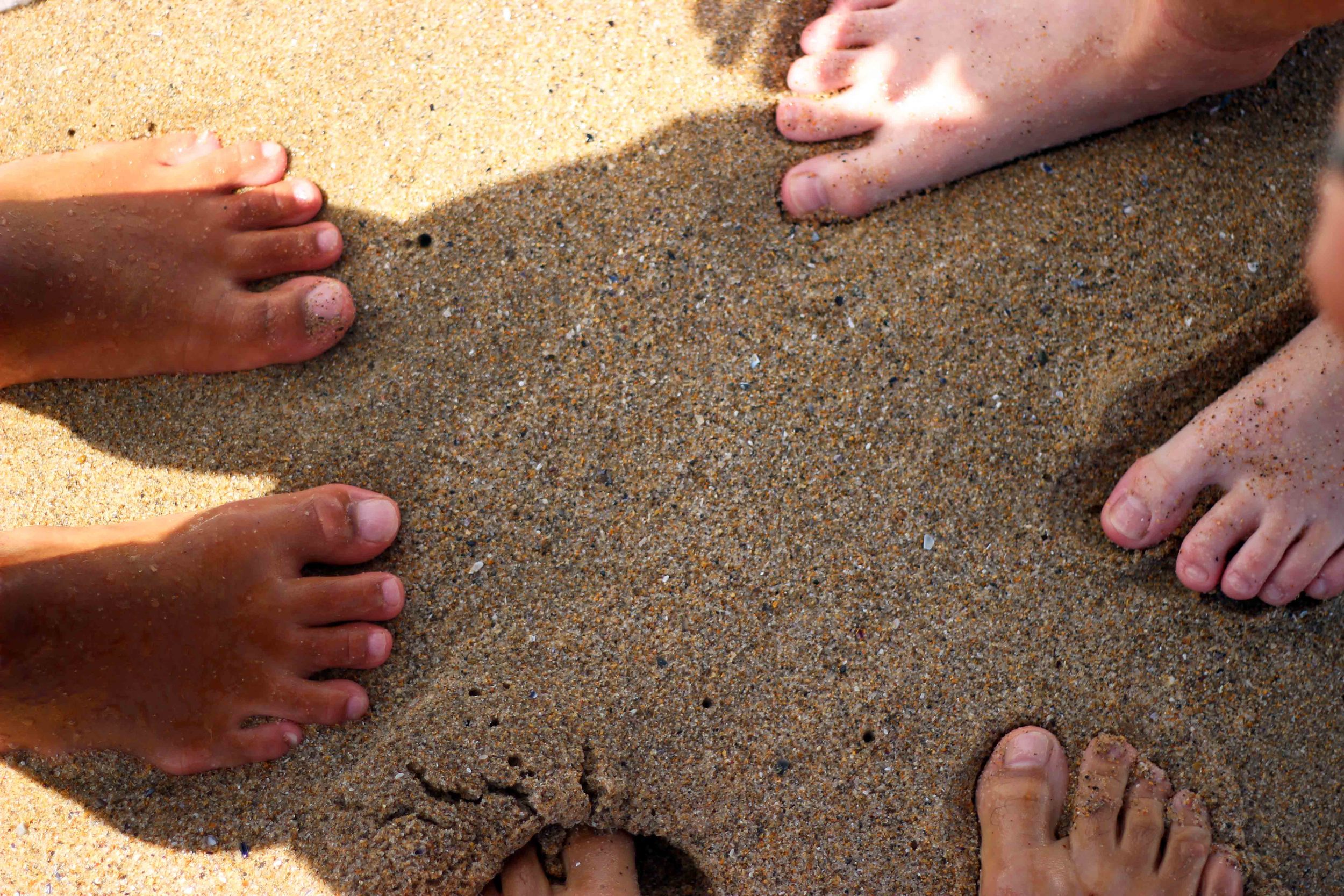 the unique feeling of being barefoot on a sandy beach